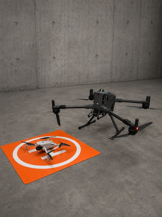 Drone resting on a landing pad